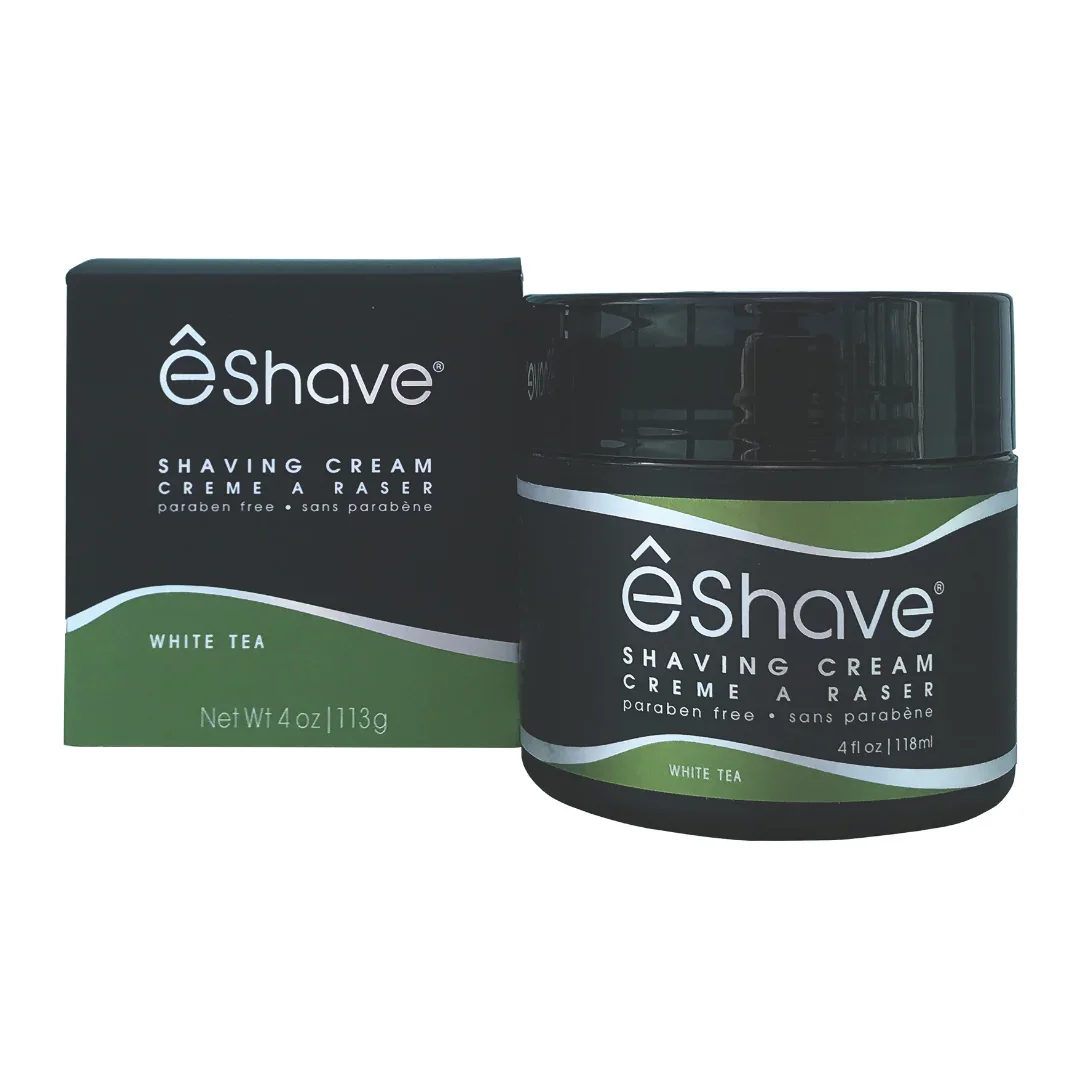 Rasiercreme Behälter und Verpackung "Shaving Cream White Tea" von eShave. Schwarzes Gefäß mit grünem Etikett.