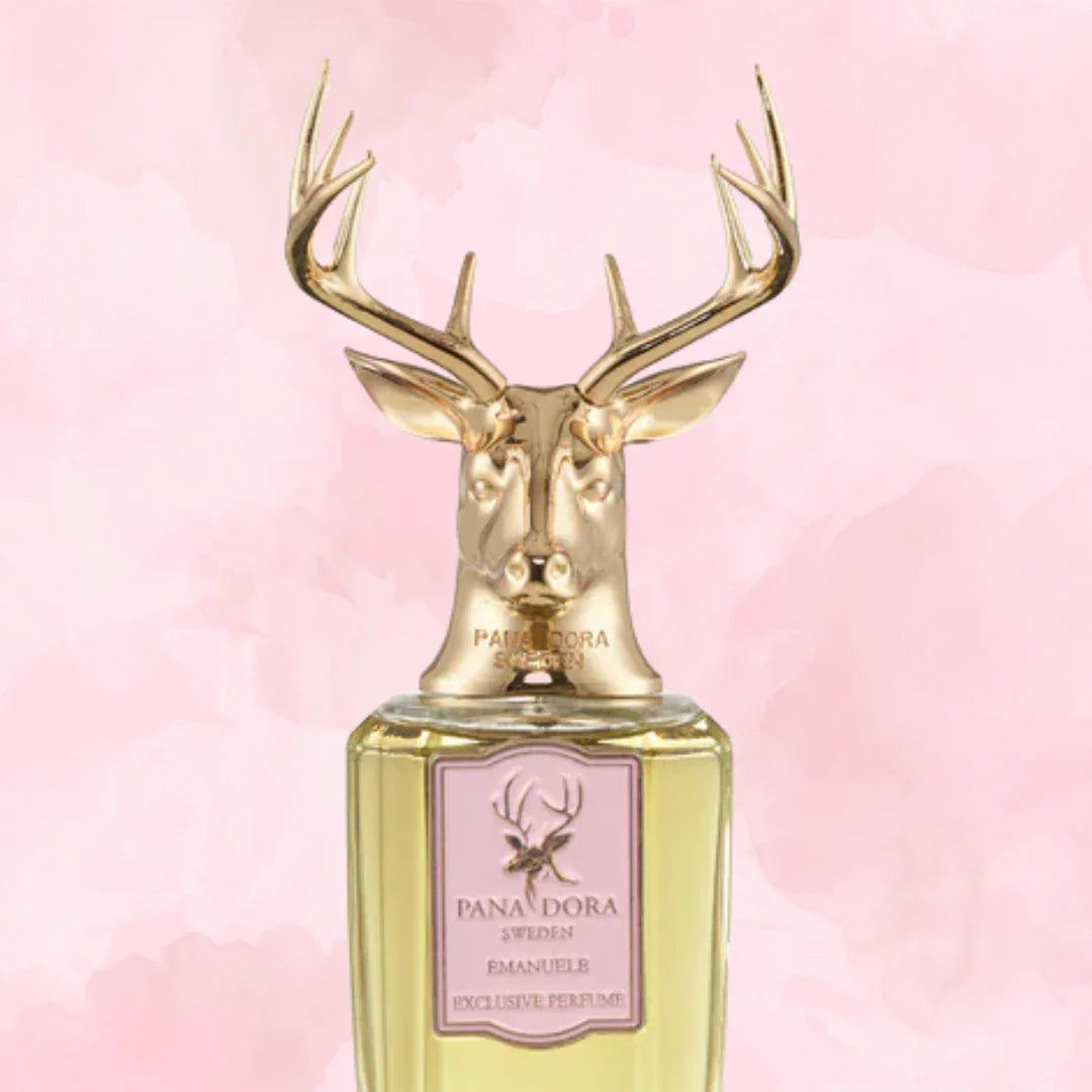 Parfümflakon mit goldener Hirschkopfskulptur als Verschluss, "Emanuele" von Pana Dora, mit zartem Etikett vorne.