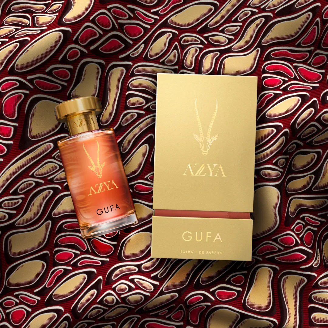 Parfumflasche "Gufa" von Azya mit goldenem Verschluss und Etikett. Daneben eine passende goldene Verpackung.
