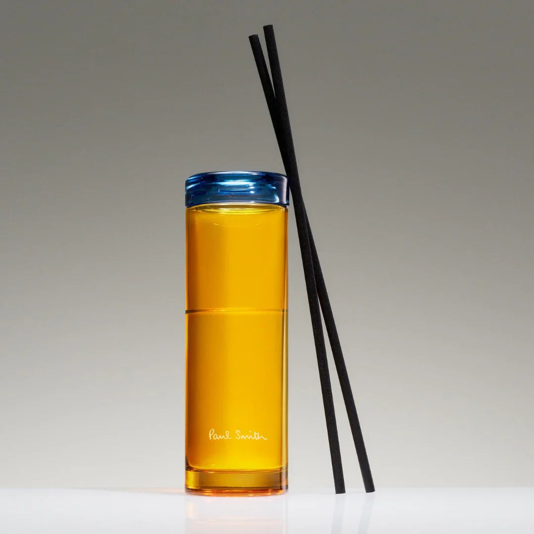 Zylinderförmiger Diffuser "Day Dreamer" von Paul Smith mit gelber Flüssigkeit. Enthält schwarze Duftstäbchen.