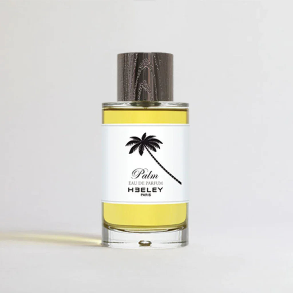 Glasflakon mit gelblicher Flüssigkeit, Palm-Design auf dem Etikett. Produktname: Palm. Hersteller: Heeley.