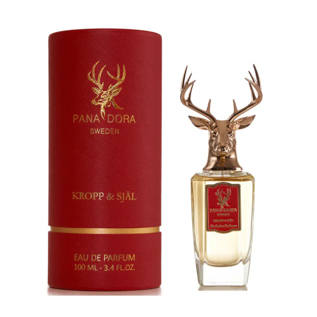 Eau de Parfum "Kropp & Själ" von Pana Dora, 100 ml Flasche mit Hirschkopf-Verschluss, rote Verpackung mit goldener Aufschrift.