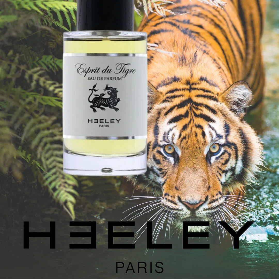 Parfümflasche "Esprit du Tigre" von Heeley mit schwarzem Verschluss und Etikett vor einem Tigerhintergrund.
