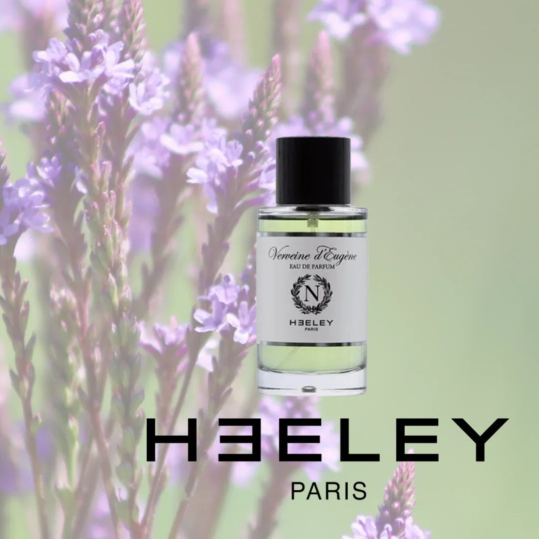 Flasche "Verveine d'Eugène" von Heeley, durchscheinendes Glas mit schwarzem Verschluss, floraler Hintergrund.