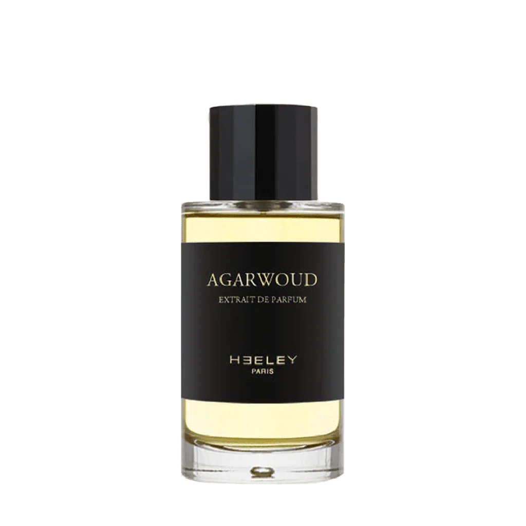 Parfümflasche "Agarwoud" von Heeley, zylindrisch, mit schwarzem Etikett und schwarzem Verschluss.