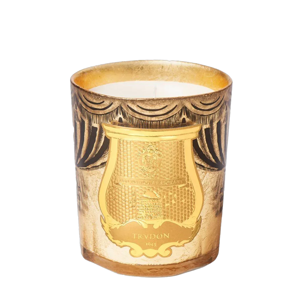 Goldene und schwarze Duftkerze mit aufwendigem Relief-Muster und "Trudon" Emblem. Produkt: AROSA - Duftkerze, Anbieter: Trudon.