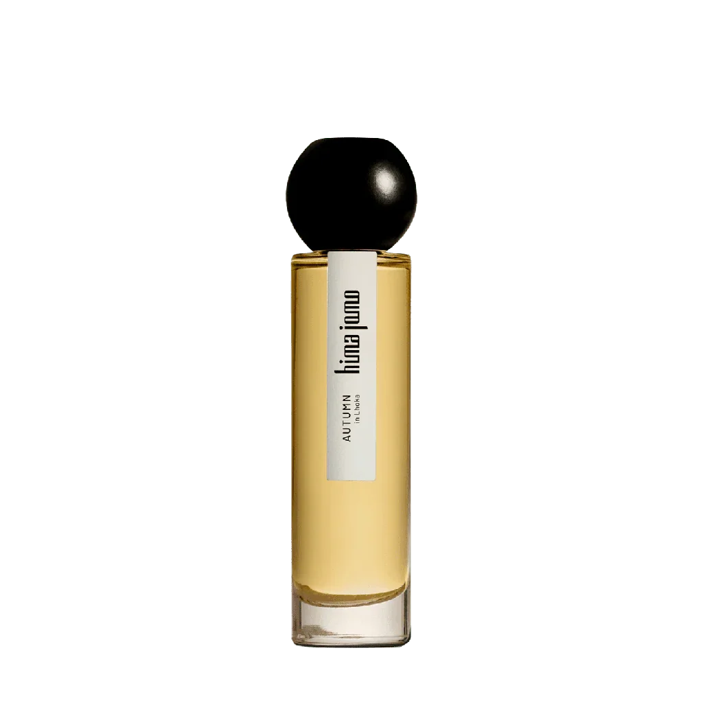 Parfümflakon mit gelber Flüssigkeit, schwarzem Kugelverschluss und langem, schlankem Design. Titel: "Seasons Collection - Autumn in Lhoka", Anbieter: hima jomo.