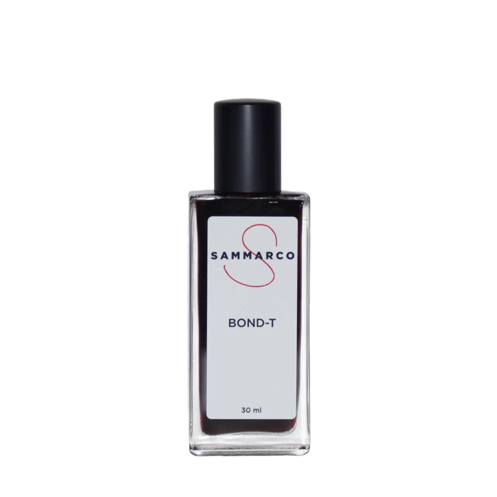 Klares rechteckiges Glasfläschchen, mit schwarzem Verschluss, Etikett mit Aufschrift "SAMMARCO Bond-T 30 ml".