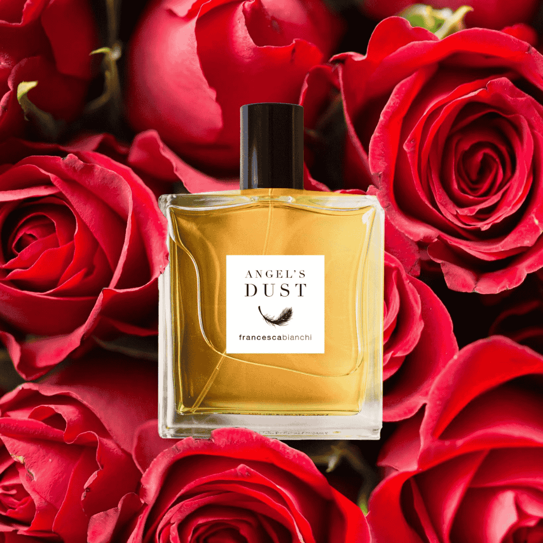 Flakon von Francesca Bianchi Angel's Dust Extrait de Parfum vor Rosen, entdecke ihn bei scent amor