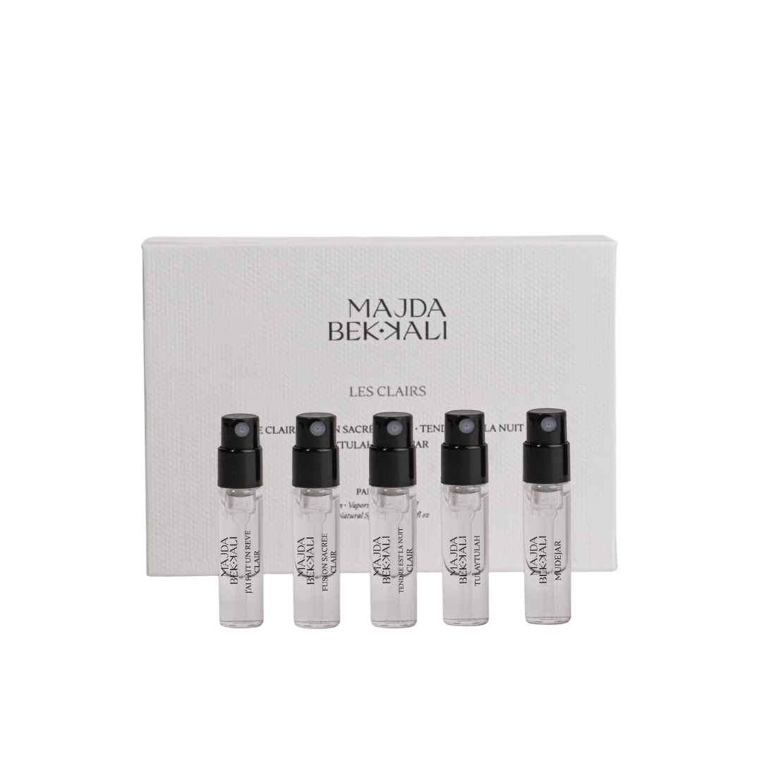 Majda Bekkali Les Clairs Discovery Set, Duftset mit fünf Probenflakons vor eleganter Box, erhältlich bei scent amor