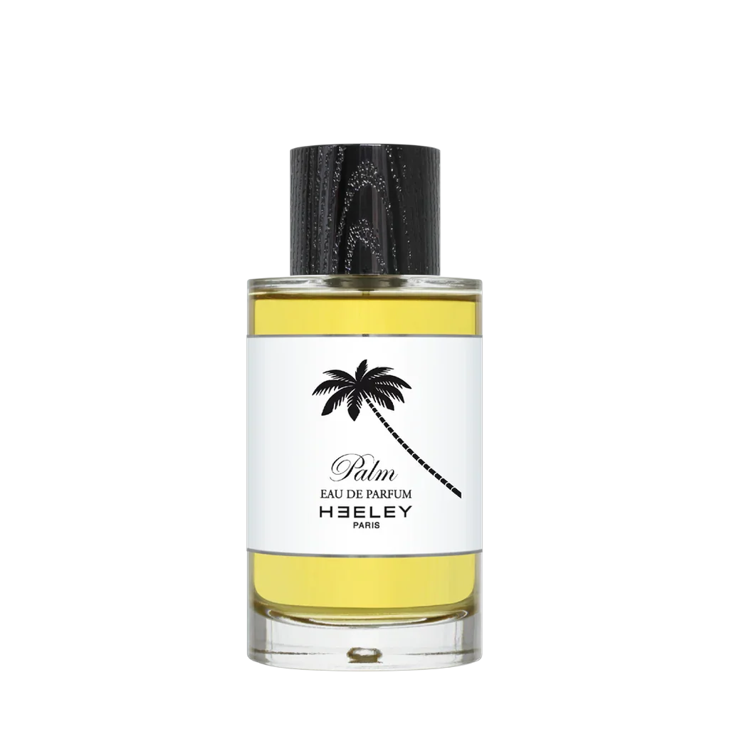 "Palm" Eau de Parfum von Heeley in einem zylindrischen Glasflakon mit silbernem Verschluss und Palmenmotiv auf dem Etikett.