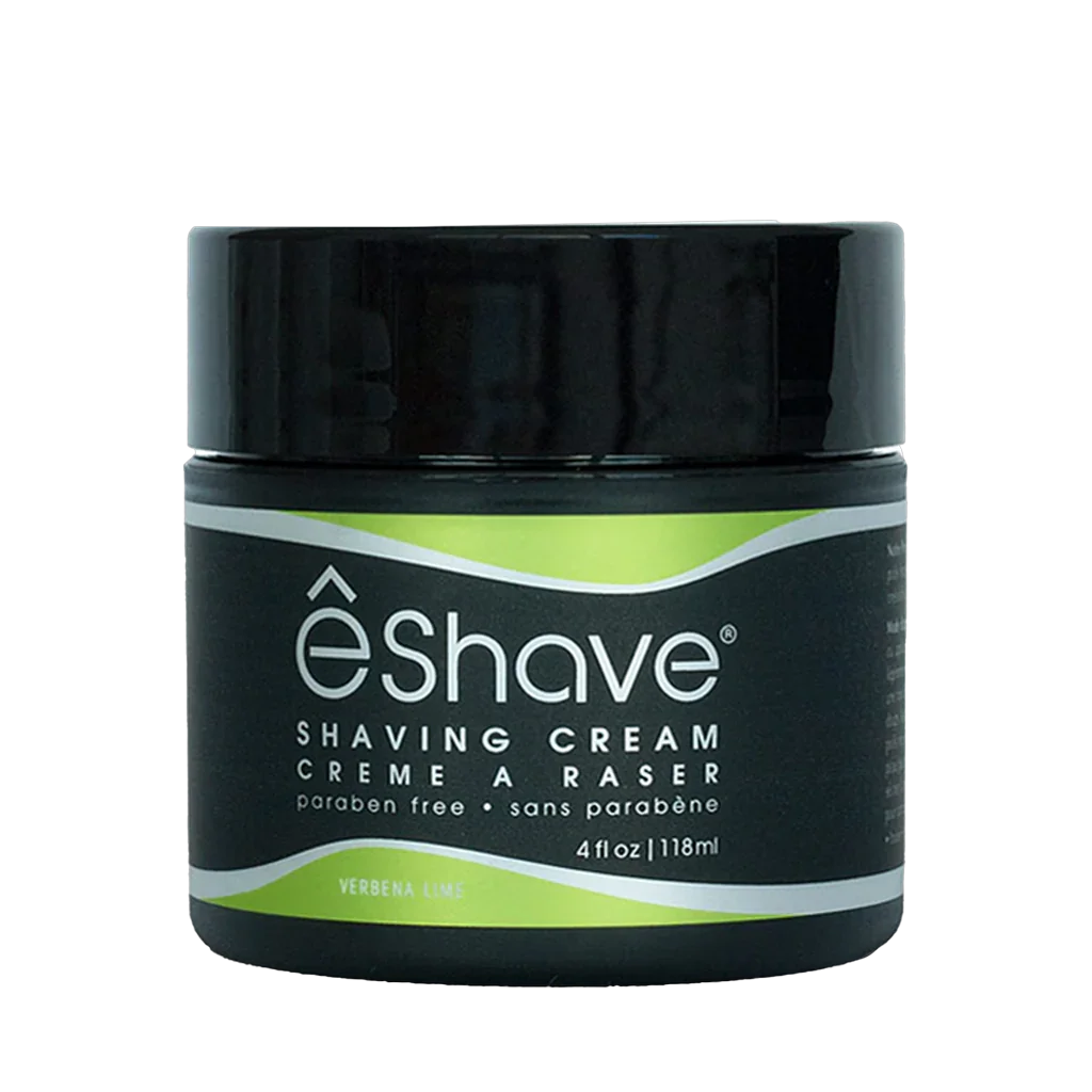 Schwarzer Behälter mit grüner Etikette, darauf der Schriftzug "êShave". Produkt: Shaving Cream Verbena Lime. Hersteller: eShave.