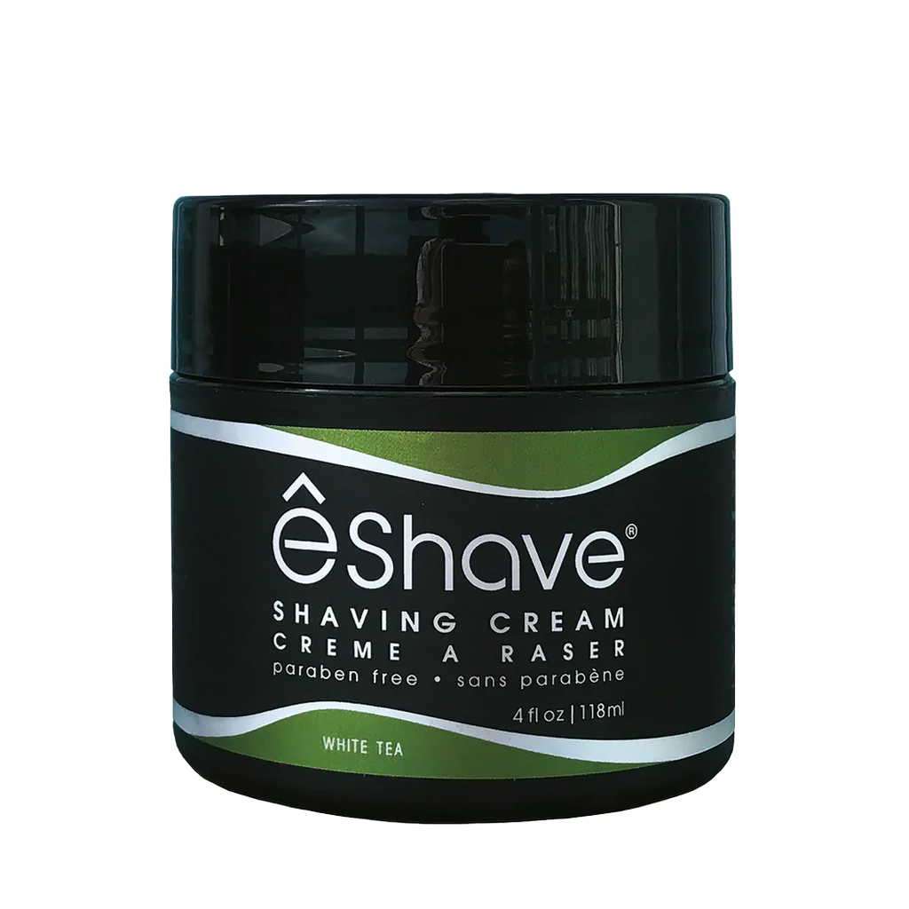 Runde schwarze Dose mit grünem Etikett, Aufschrift "eShave Shaving Cream White Tea". Hersteller: eShave.