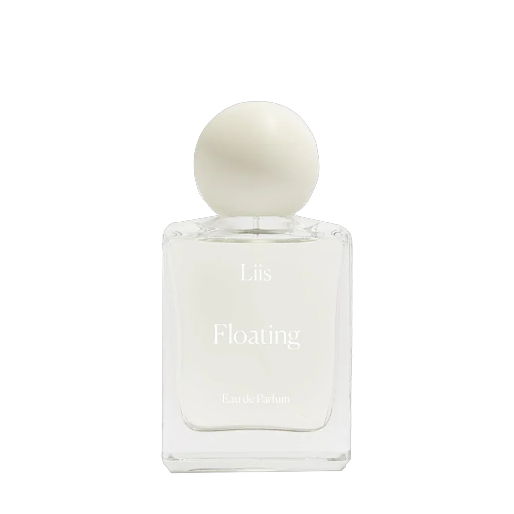 Klare Glasflasche mit weißer Kugelkappe, Beschriftung "Liis Floating Eau de Parfum". Produkt von Liis.