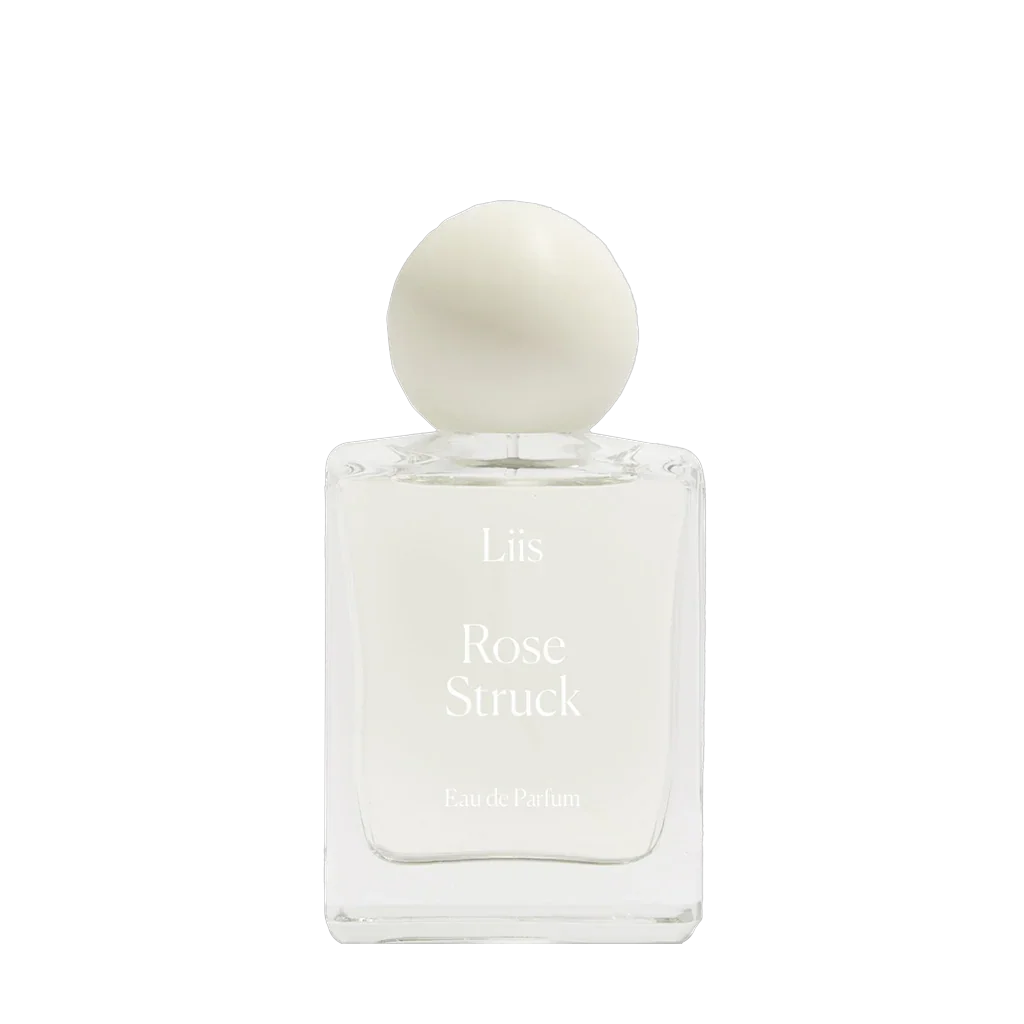Liis Rose Struck Eau de Parfum mit klarem Glasflakon und rundem weißen Verschluss.